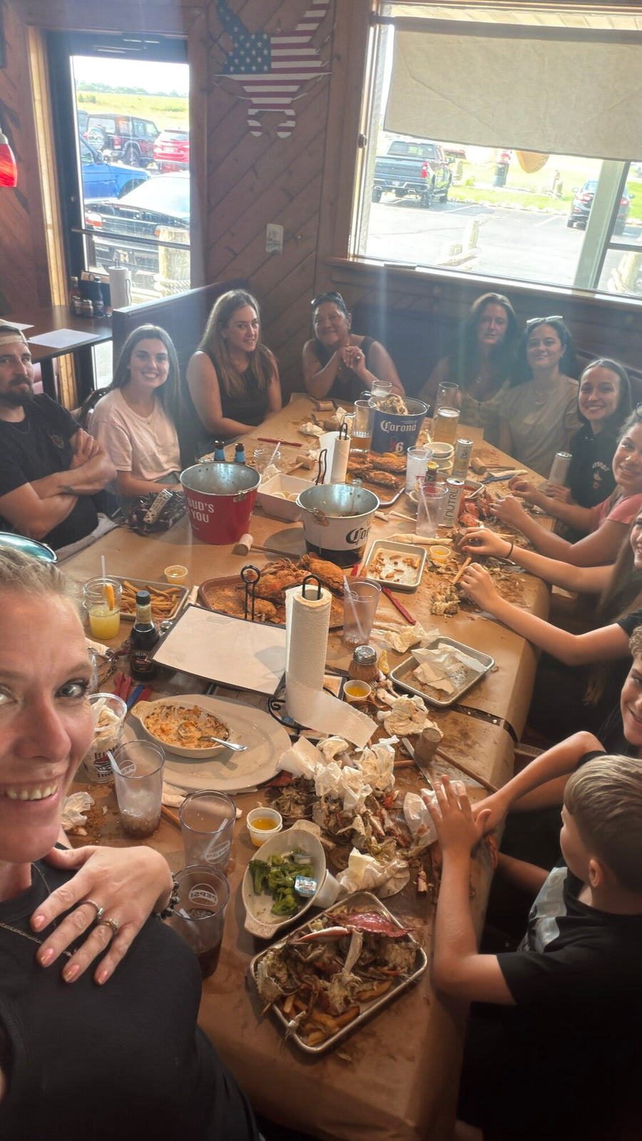 A long table covered in crabs, mallets and buckets at the staff crab feast