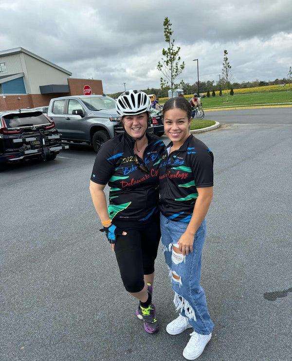 Niki and a fellow rider in Bike to the Bay jerseys