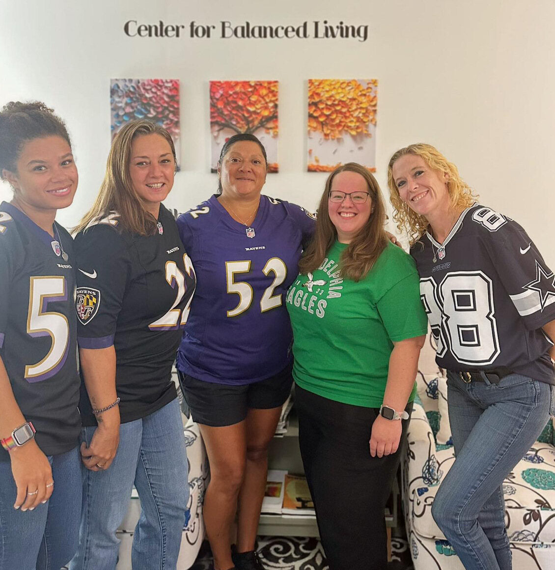 The team in football jerseys in the Center for Balanced Living waiting room