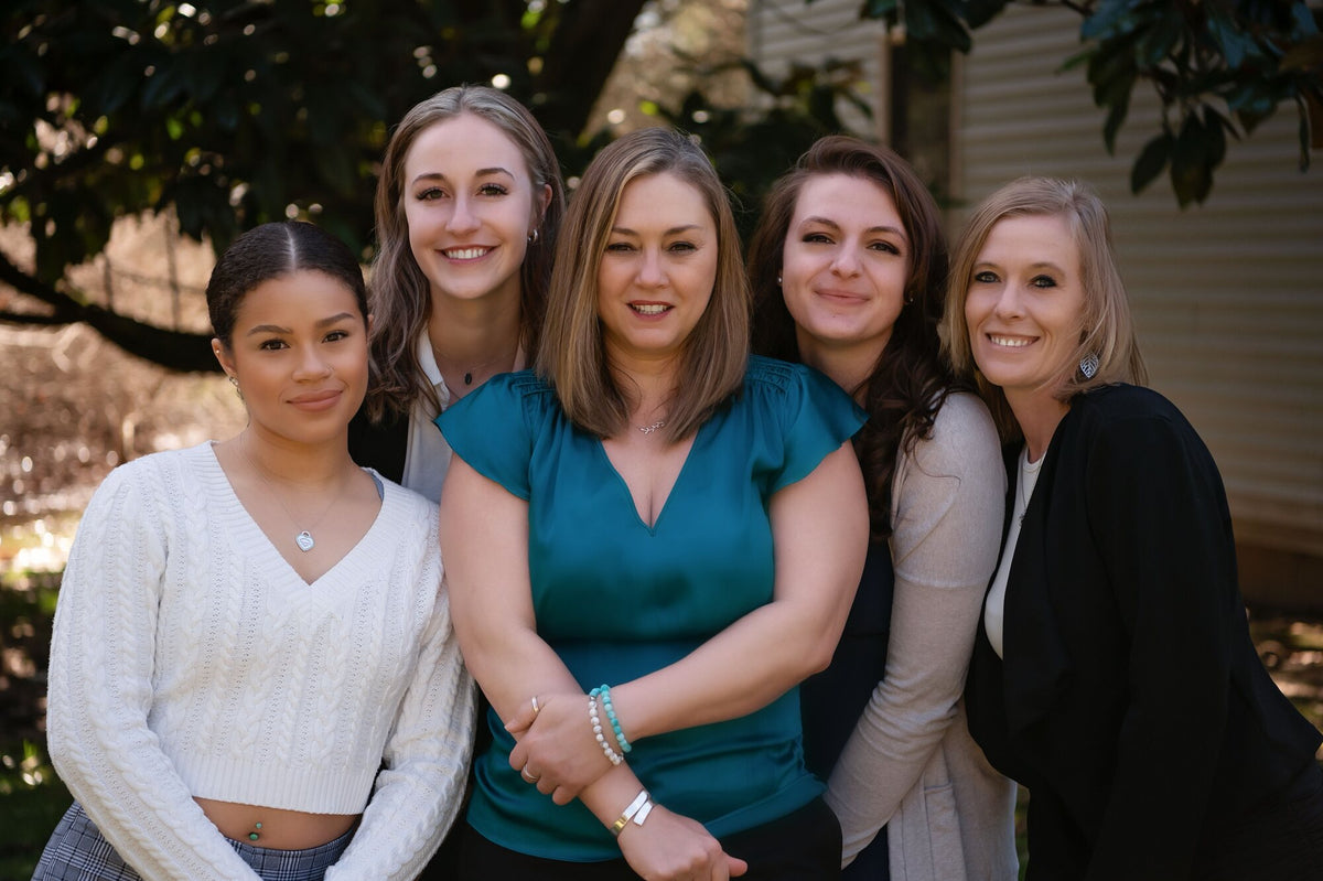 The original Center for Balanced Living team under the magnolia, 2024