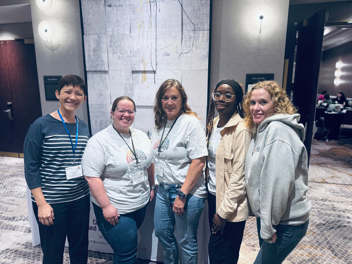 Clinicians at a grief training in a hotel conference room